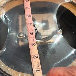 Stainless Steel Pot Lid with Handle and a frying pan